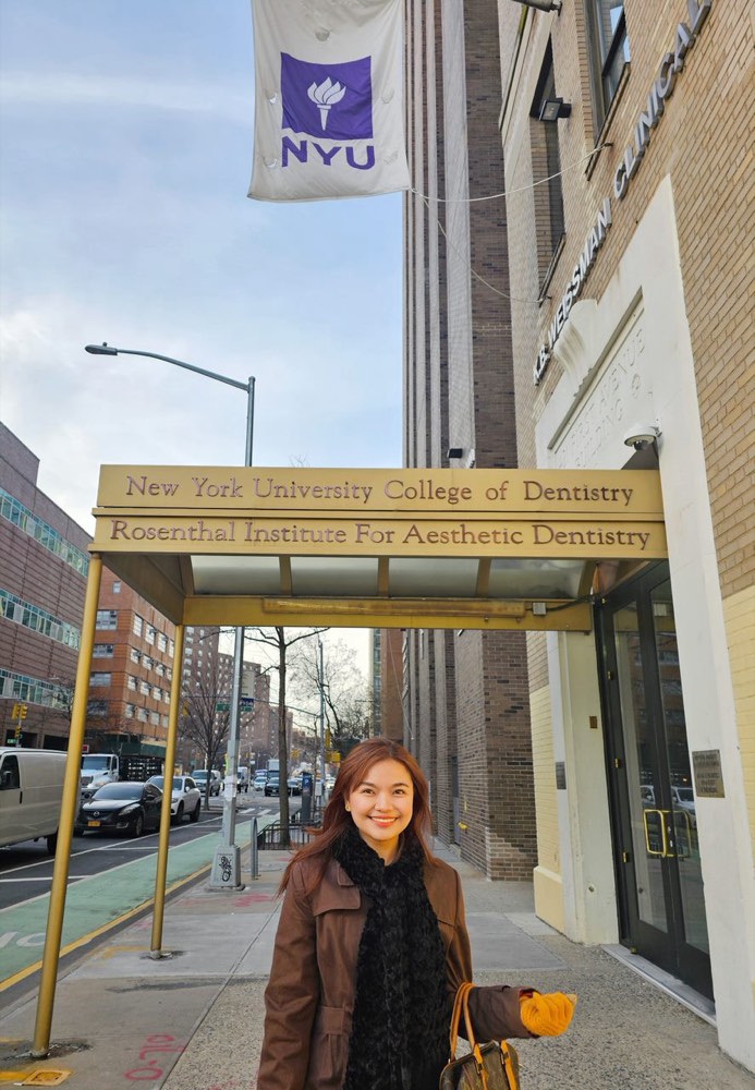 Dr. KC standing outside the New York University College of Dentistry, Rosenthal Institute for Aesthetic Dentistry